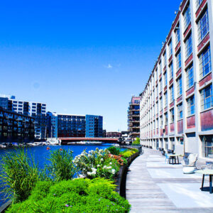 Exterior photograph of the riverwalk along MIAD's building