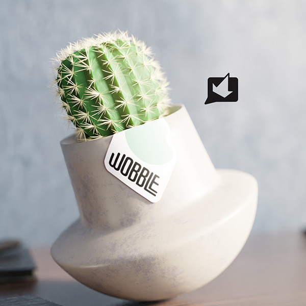 A wobbling cement planter with a cactus. 